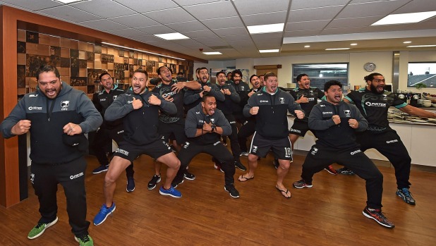 Jurgen Klopp is presented with a Kiwis jersey at Liverpool's training base