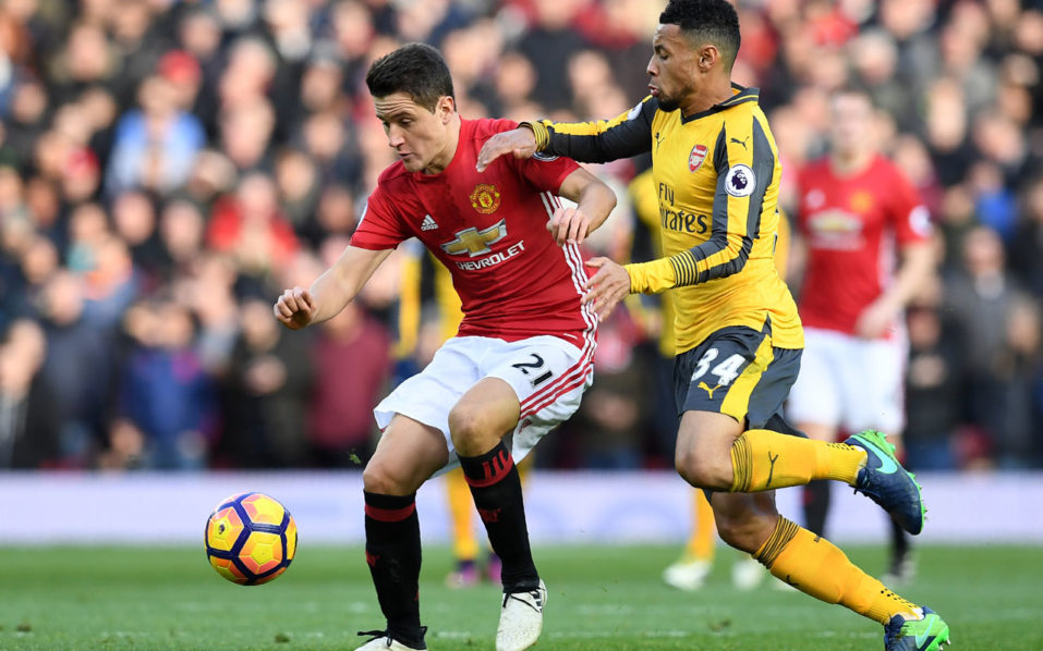 Manchester United's Spanish midfielder Ander Herrera vies with Arsenal's French midfielder Francis Coquelin during the English Premier League football match between Manchester United and Arsenal at Old Trafford in Manchester north west England on No