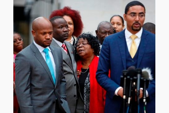 Judy Scott center Walter Scott's mother is comforted by her son Rodney Scott as the family attorneys Chris Stewart left and Justin Bamberg right hold a press conference after a mistrial was declare