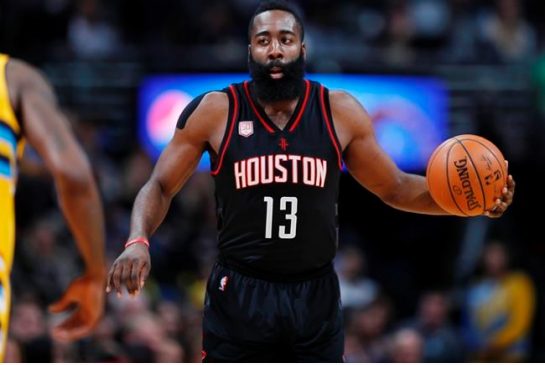 Houston Rockets guard James Harden brings the ball upcourt against the Denver Nuggets in the first half of an NBA basketball game late Friday Dec. 2 2016 in Denver