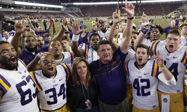 LSU coach Ed Orgeron celebrates with players after an NCAA college football game against Texas A&M Thursday Nov. 24 2016 in College Station Texas