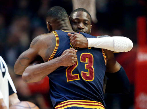 Chicago Bulls guard Dwyane Wade rear hugs Cleveland Cavaliers forward Le Bron James before an NBA basketball game Friday Dec. 2 2016 in Chicago