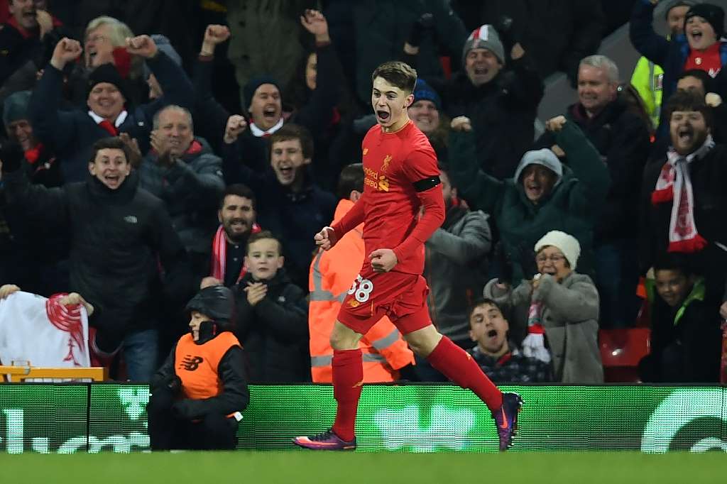 Liverpool's Welsh striker Ben Woodburn celebrates scoring a goal during the EFL Cup quarter-final match