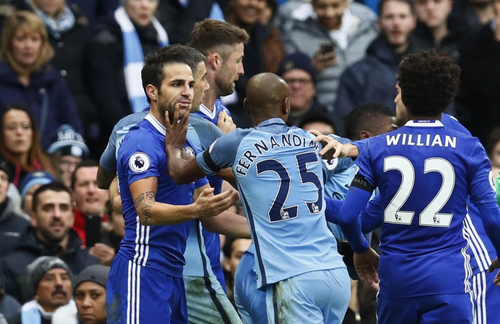 Manchester City's Fernandinho clashes with Chelsea's Cesc Fabregas before being sent off