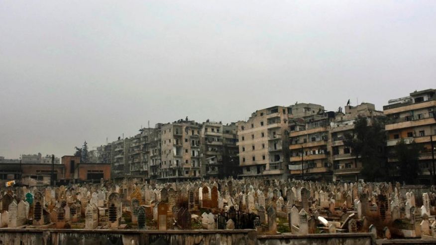 Syrian official news agency SANA shows a graveyard in east Aleppo Syria Tuesday Dec. 13 2016. Syrian rebels said Tuesday that they reached a cease-fire deal with Moscow to evacuate civilians and fighters from eastern Aleppo