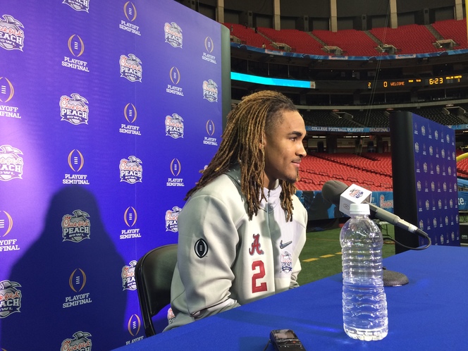 Alabama quarterback Jalen Hurts chats with reporters during Thursday's Peach Bowl media day at the Georgia Dome