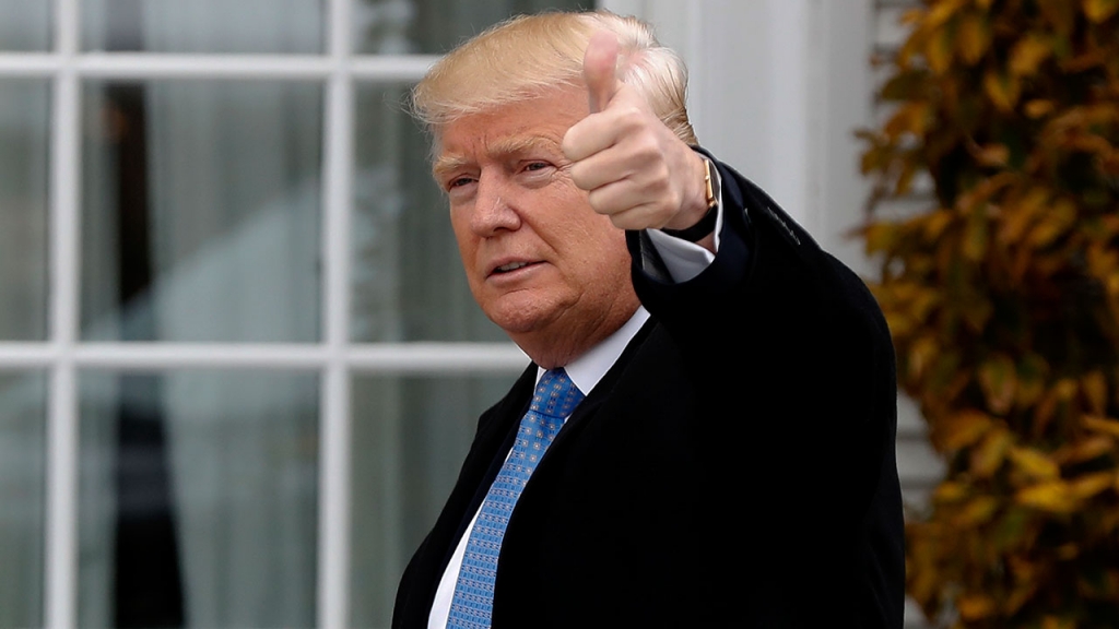 FILE- President-elect Donald Trump gives the thumbs up as he arrives at the Trump National Golf Club Bedminster clubhouse Sunday Nov. 20 2016 in Bedminster N.J