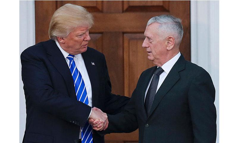 President-elect Donald Trump shakes hands with retired Gen. James Mattis at the clubhouse of Trump International Golf Club