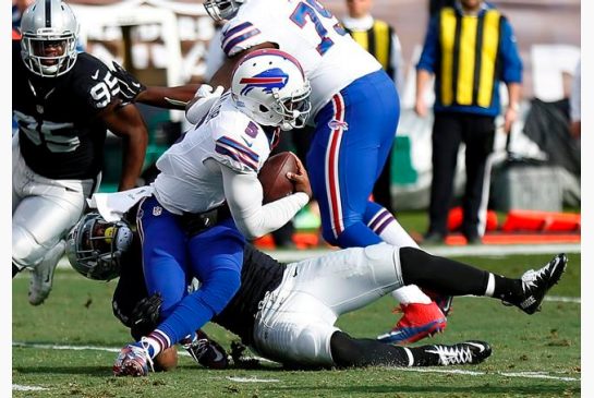 Buffalo Bills quarterback Tyrod Taylor is sacked by Oakland Raiders outside linebacker Bruce Irvin during the first half of an NFL football game in Oakland Calif. Sunday Dec. 4 2016