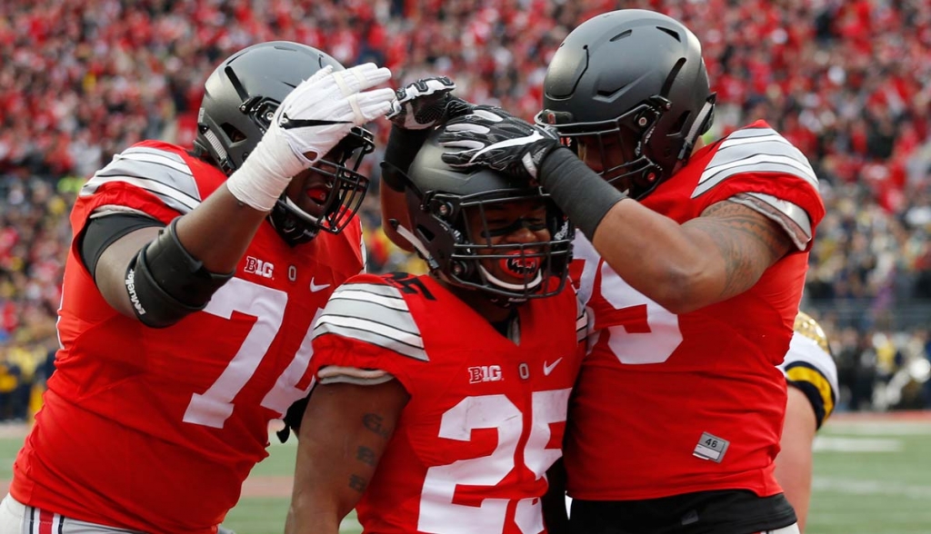 Ohio State running back Mike Weber center celebrates his touchdown against Michigan with teammates Jamarco Jones left and Luke Farrell during the second half of an NCAA college football game in Columbus Ohio. (AP Ph