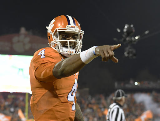 Clemson quarterback Deshaun Watson reacts after throwing a touchdown pass to Artavis Scott during the second half of an NCAA college football game against South Carolina in Clem