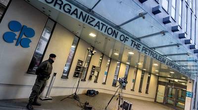 An Austrian soldier stands guard outside the OPEC headquarters on the eve of the 171th meeting of the Organization of the Petroleum Exporting Countries in Vienna on Tuesday