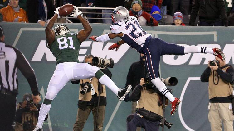 New York Jets wide receiver Quincy Enunwa catches a touchdown pass over New England Patriots corner back Malcolm Butler during the fourth quarter at Met Life Stadium