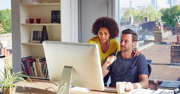 Coworkers working together | Kelvin Murray  Getty Images