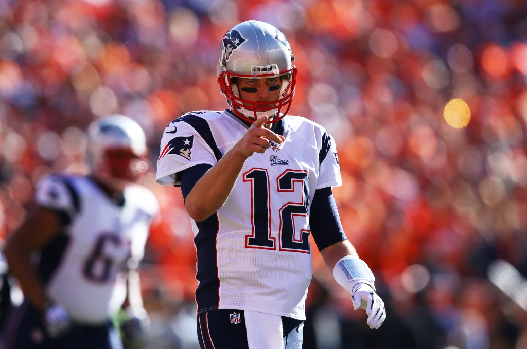 DENVER CO- JANUARY 19 Tom Brady #12 of the New England Patriots reacts in the first quarter against the Denver Broncos during the AFC Championship game at Sports Authority Field at Mile High