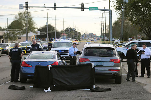 Police investigate the shooting scene on December 1 in Terrytown La