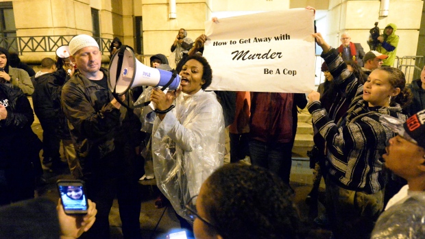 Protesters chant in the aftermath of no indictment being given in the death of Keith Scott outside Charlotte police headquarters on Wednesday