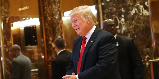 President-elect Donald Trump pauses to briefly speak to the media at Trump Tower