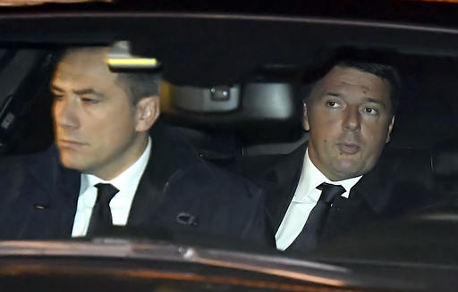 Italian Premier Matteo Renzi right arrives at the Quirinale presidential palace to meet President Sergio Mattarella and tender his resignation in Rome Monday Dec. 5 2016. Italian voters dealt Premier Matteo Renzi a