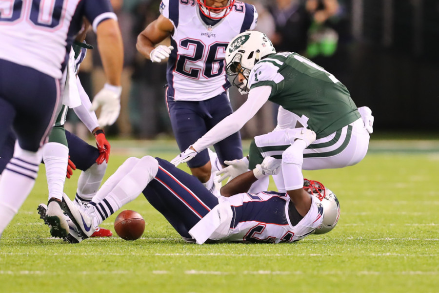 EAST RUTHERFORD NJ- NOVEMBER 27 New York Jets wide receiver Robby Anderson fumbles during the second quarter of the National Football League game between the New England Patriots and the New York Jets