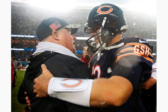 San Francisco 49ers head coach Chip Kelly left talks to Chicago Bears quarterback Matt Barkley after their NFL football game Sunday Dec. 4 2016 in Chicago. The Bears won 26-6