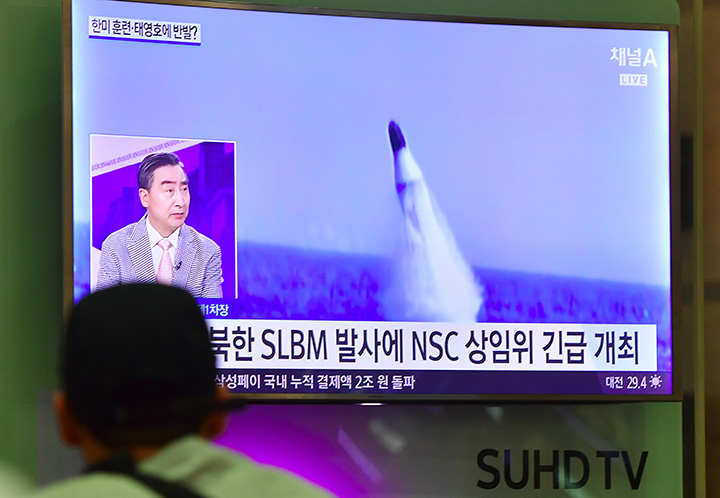 MISSILE POWER – A man at Incheon airport watches a television newscast showing file footage of a North Korean missile launch last August. North Korea test-fired a submarine-launched ballistic missile last August 24 days after threatening a nuclear stri