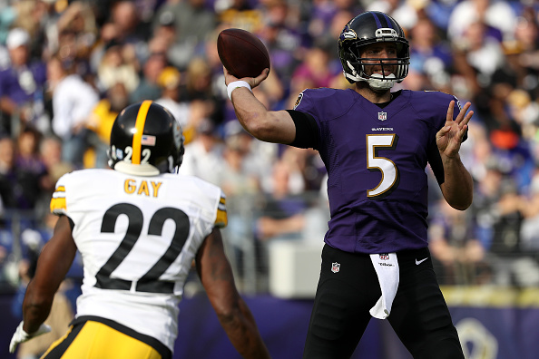 BALTIMORE MD- NOVEMBER 6 Quarterback Joe Flacco #5 of the Baltimore Ravens passes the ball while under pressure by cornerback William Gay #22 of the Pittsburgh Steelers in the second quarter at M&T Bank Stadium