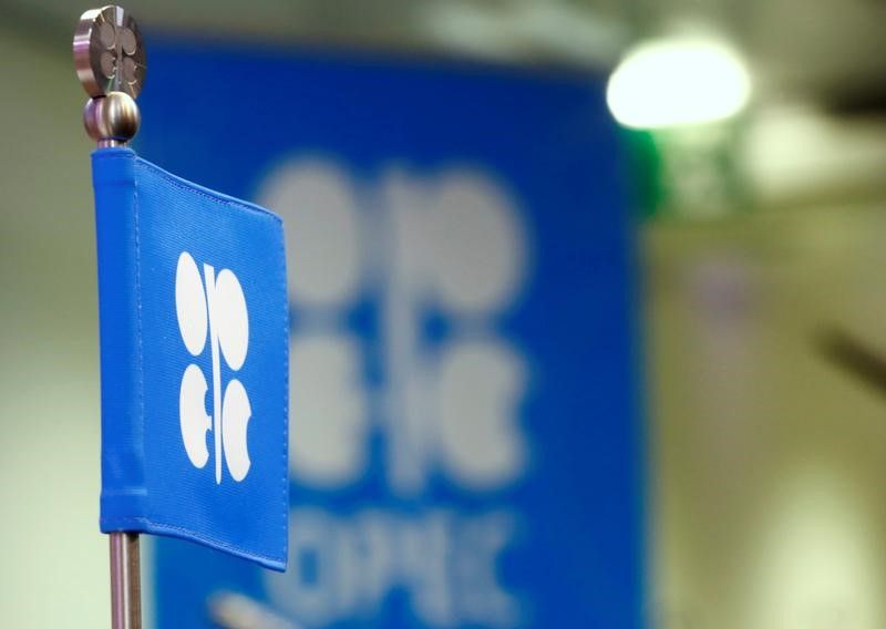 The OPEC flag and the OPEC logo are seen before a news conference in Vienna