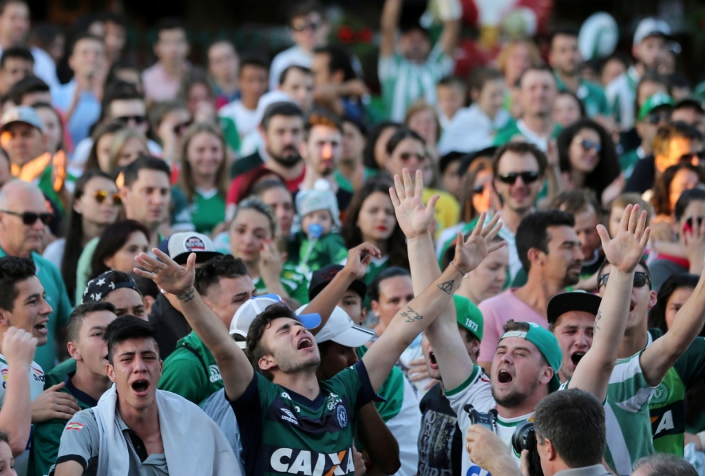 The city's residents turned out in their team's green and white kit to mourn the deadReuters