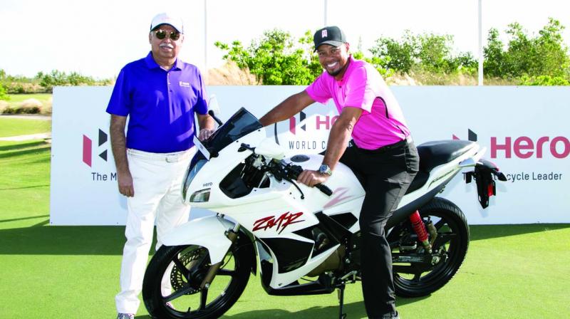 Tiger Woods and Pawan Munjal strike a moment at Albany venue of the Hero World Challenge that tees off in The Bahamas on Thursday