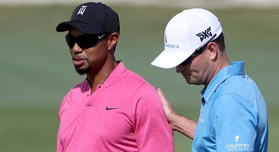 Tiger Woods talks with Zach Johnson as they practice ahead of the Hero World Challenge at Albany The Bahamas on Nov. 29 in Nassau Bahamas.- AFP