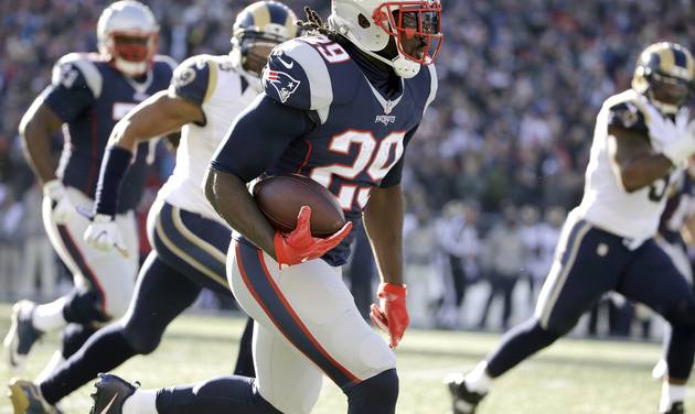 New England Patriots running back Le Garrette Blount runs for a touchdown against the Los Angeles Rams during the first half of an NFL football game Sunday Dec. 4 2016 in Foxborough Mass