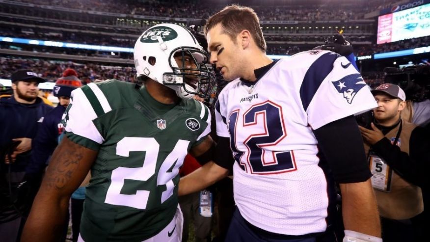 EAST RUTHERFORD NJ- NOVEMBER 27  Darrelle Revis #24 of the New York Jets talks with Tom Brady #12 of the New England Patriots after their game at Met Life Stadium