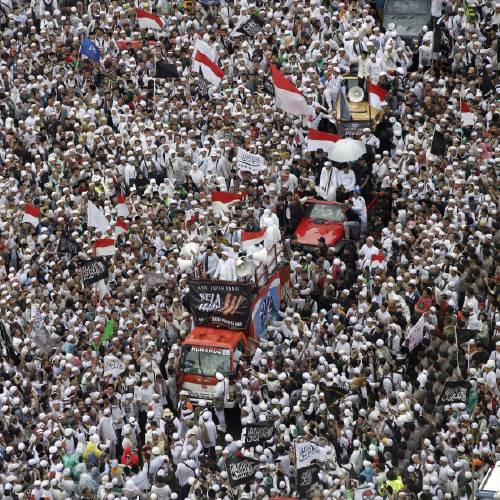 Muslims gather during a protest against Jakarta's minority Christian Governor Basuki'Ahok Tjahaja Purnama who is being prosecuted for blasphemy at the National Monument in Jakarta Indonesia Friday Dec. 2 2016. Tens of thou