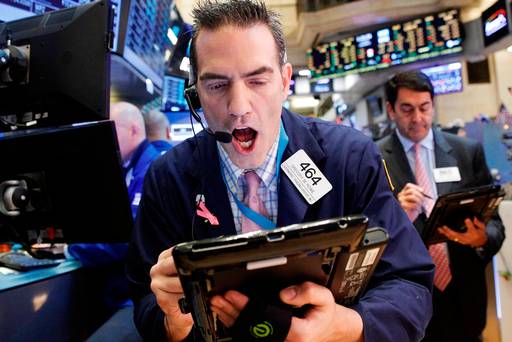 Traders work on the floor of the New York Stock Exchange