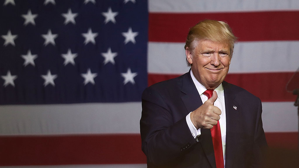 WEST PALM BEACH FL- OCTOBER 13 Republican presidential candidate Donald Trump gives a thumbs up during a campaign rally at the South Florida Fair Expo Center