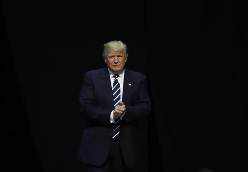 President-elect Donald Trump arrives to speak to supporters during a rally in Grand Rapids Mich. Trump is facing an early test with fellow Republicans over U.S. relations with Russia. Lawmakers are seeking to inve