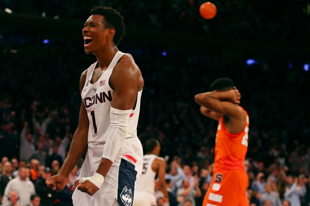 NEW YORK NY- DECEMBER 05 Christian Vital #1 of the Connecticut Huskies celebrates after defeating the Syracuse Orange during the Tire Pros Classic at Madison Square Garden