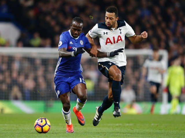 Victor Moses tries to hold off Mousa Dembele at Stamford Bridge in London