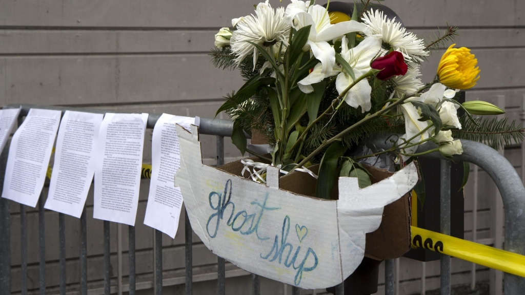 Flowers letters and handmade signs were left as a memorial to victims of the fire at the artists&#039 collective known as'Ghost Ship