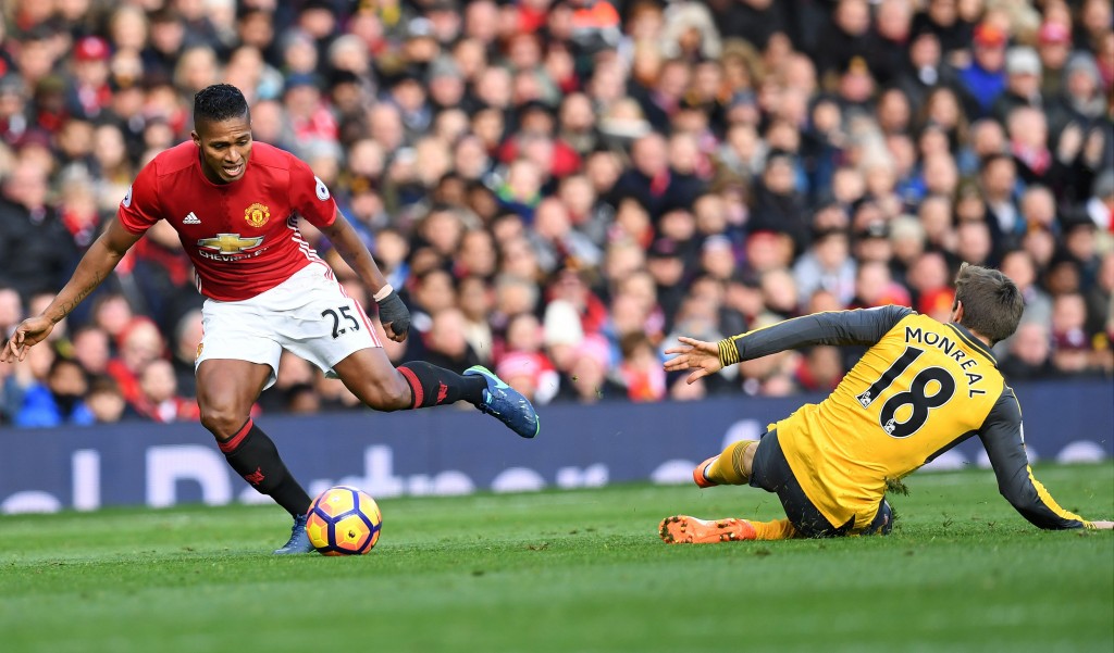 Manchester United's Ecuadorian midfielder Antonio Valencia vies with Arsenal's Spanish defender Nacho Monreal during the English Premier League football match between Manchester United and Arsenal at Old Trafford in Manchester north west England