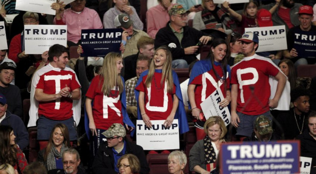 Students from Hartsville High School in Hartsville South Carolina dressed as caped crusaders for Republican presidential candidate Donald TrumpTrump cheer for Trump at the Florence Civic Center in Florence South Carolina