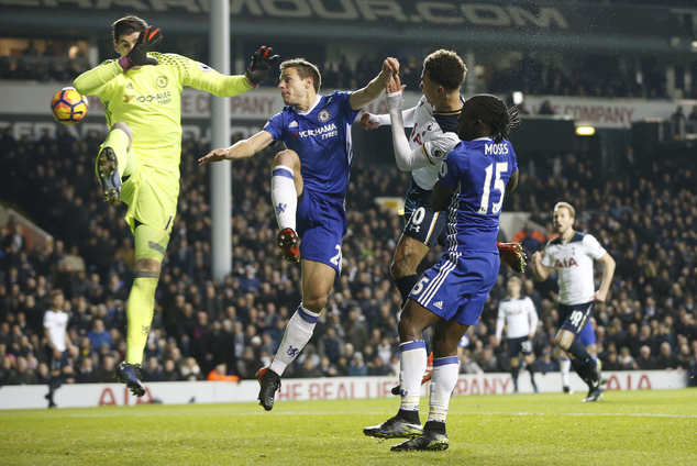 Tottenham's Dele Alli second right scores a goal during the English Premier League soccer match between Tottenham Hotspur and Chelsea at White Hart Lane