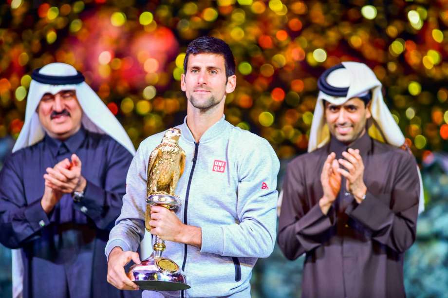 Novak Djokovic of Serbia celebrates with his trophy after winning his Qatar Open 2017 final tennis match against Britain's Andy Murray in Doha Qatar Saturday Jan. 7 2017. ORG XMIT XAP5666