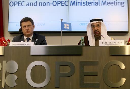 Russian Minister of Energy Alexander Novak left and Khalid Al-Falih Minister of Energy Industry and Mineral Resources of Saudi Arabia attend a news conference after a meeting of the Organization of