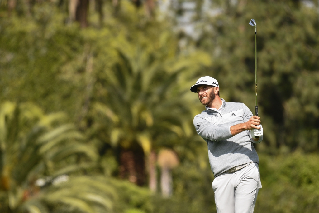 PACIFIC PALISADES CA- FEBRUARY 19 Dustin Johnson hits from the fourth hole fairway during the final round of the Genesis Open golf tournament at the Riviera Country Club