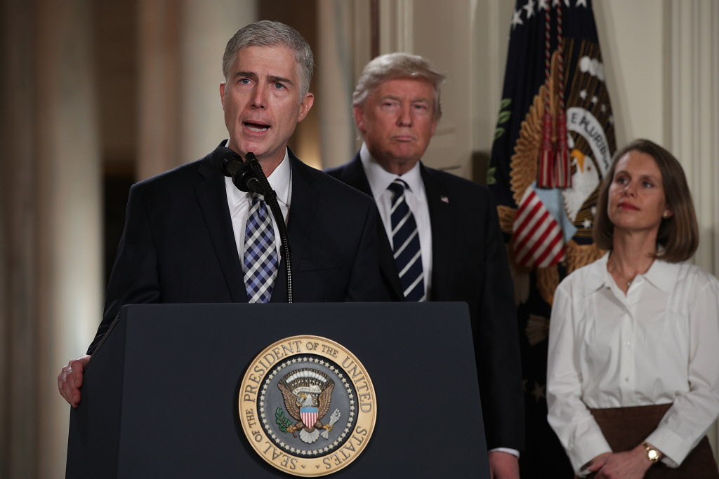 Judge Neil Gorsuch speaks to the crowd as his wife Maria Louise looks on after U.S. President Donald Trump nominated him to the Supreme Court during a ceremony in the East Room of the White House on Tuesday. | Alex Wong  Getty Images