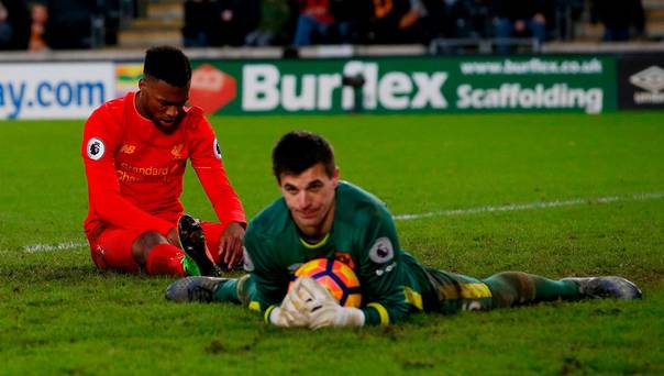 Hull City's Eldin Jakupovic gathers the ball as Liverpool's Daniel Sturridge looks dejected. Action Images via Reuters  Craig Brough