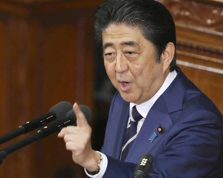 Japanese Prime Minister Shinzo Abe delivers his policy speech during a Diet session at the lower house of parliament in Tokyo. Japanese media reports say Prime Minister Shinzo Abe plans to propose a majo