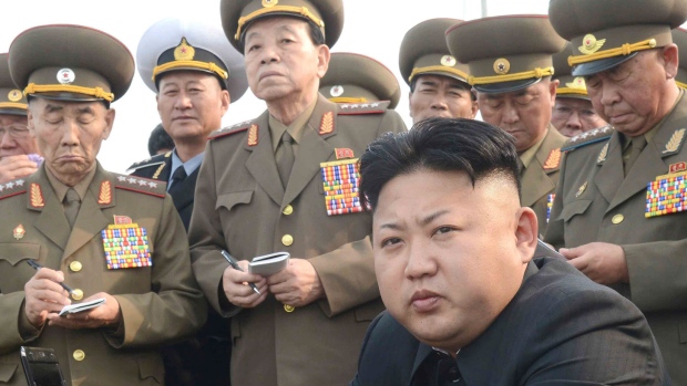 North Korean leader Kim Jong-un observes an artillery drill in this undated